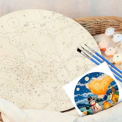 Snowman under Volcanic Sky.  Paint by numbers on Wood Slice. 20cm.